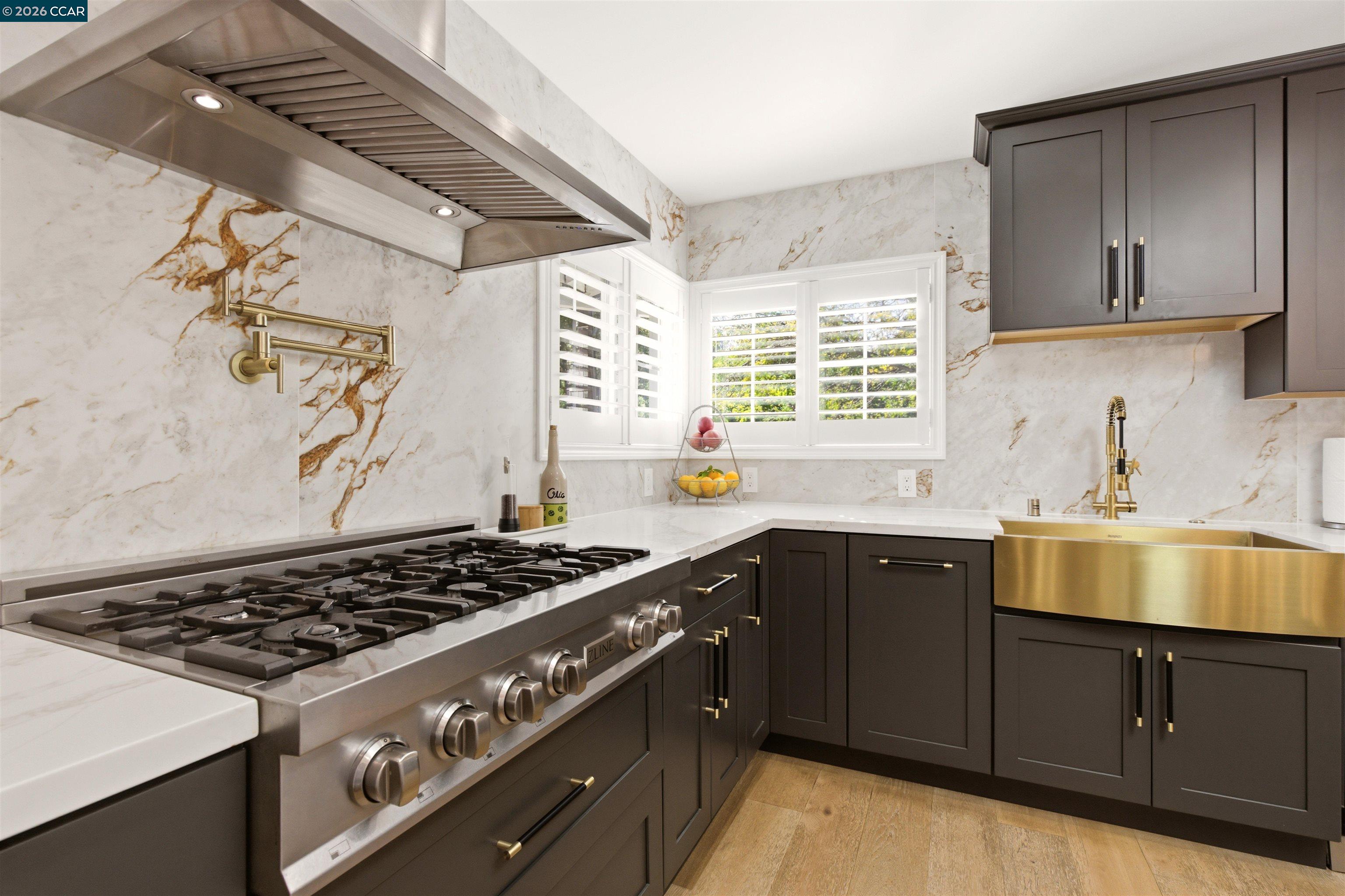 3298 Gloria Terrace Lafayette, CA 94549 - Photo 23 of 40 a kitchen with a stove and a sink