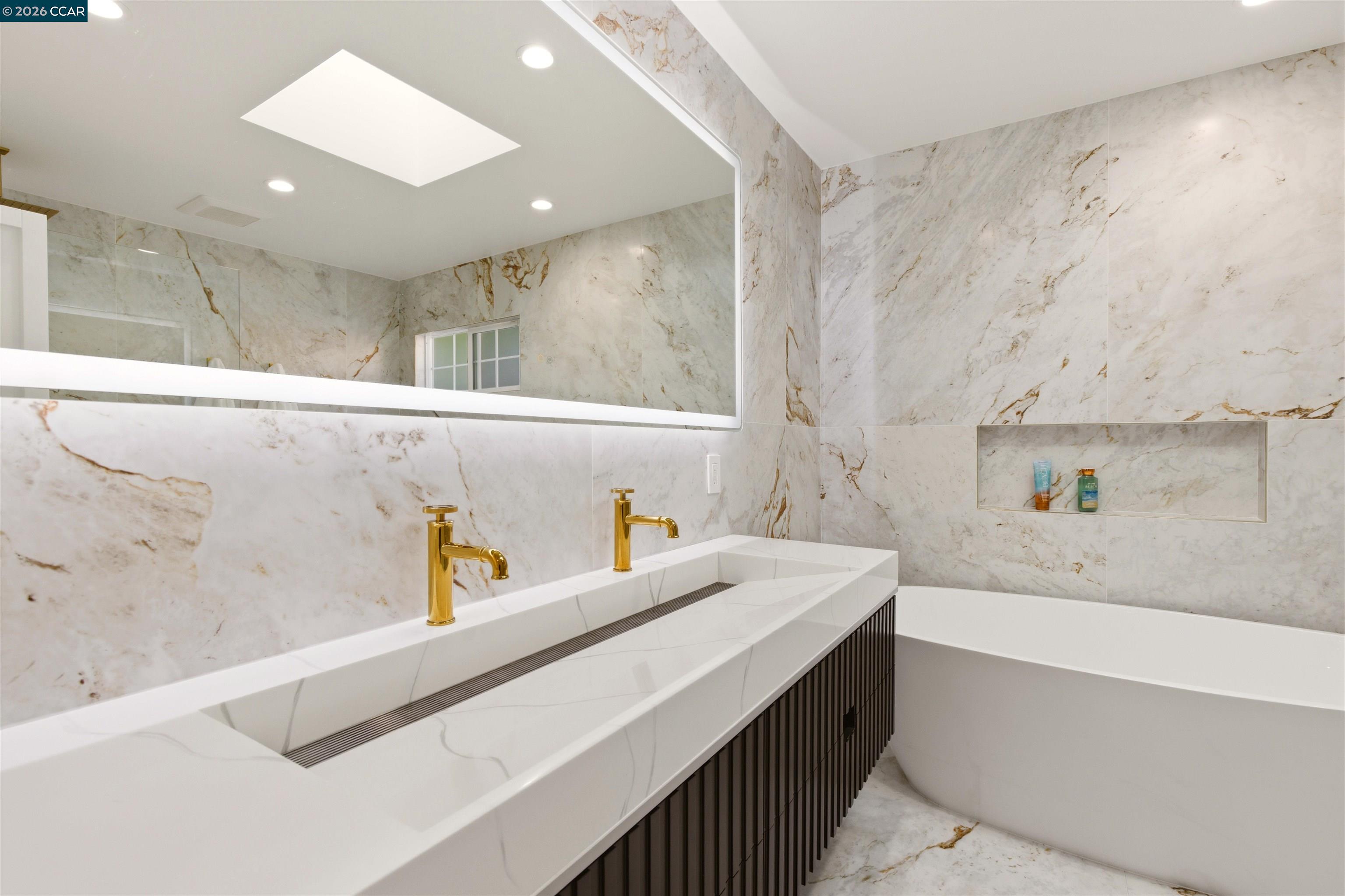 3298 Gloria Terrace Lafayette, CA 94549 - Photo 27 of 40 a bathroom with a sink a large mirror and a bathtub