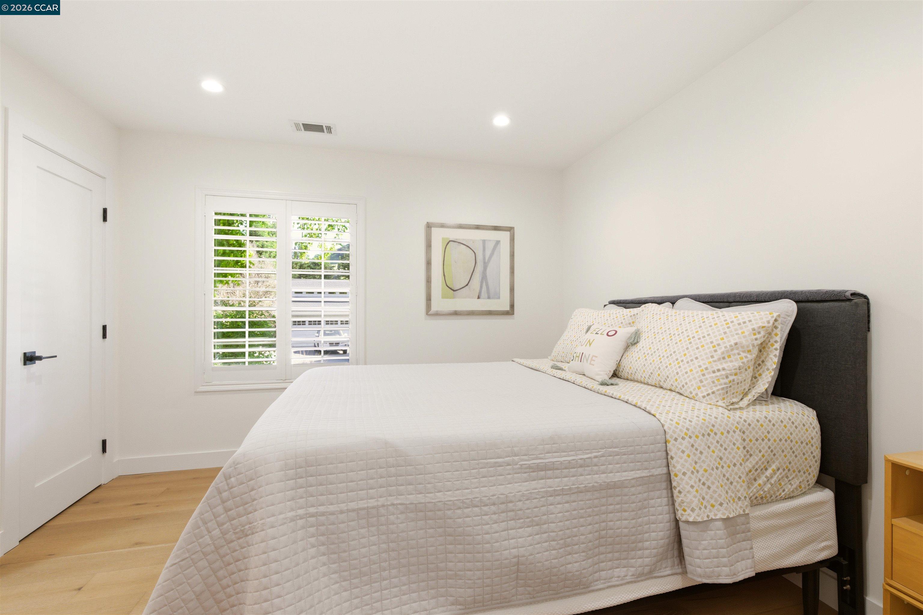 3298 Gloria Terrace Lafayette, CA 94549 - Photo 30 of 40 a large bed sitting in a bedroom next to a window