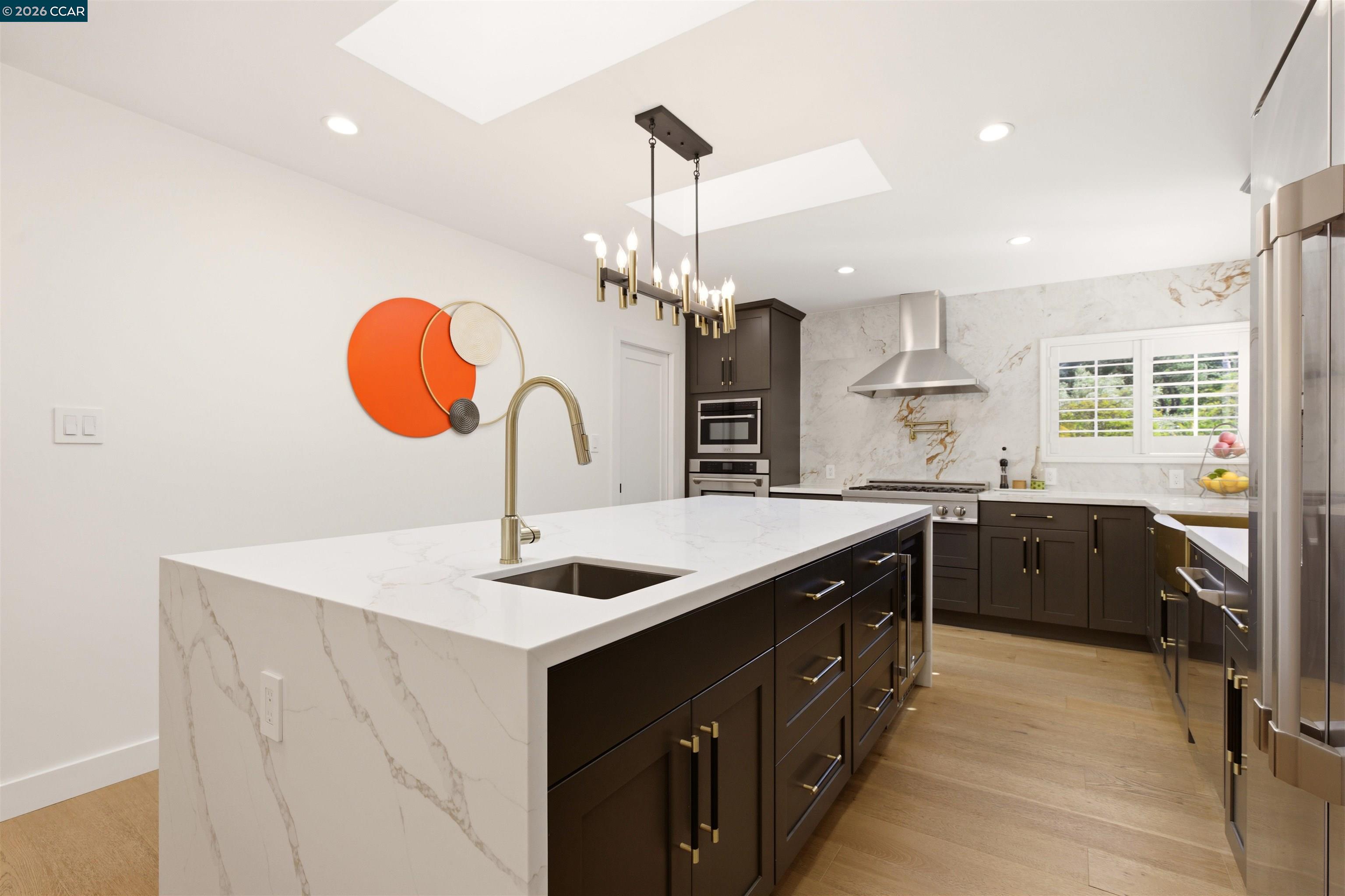 3298 Gloria Terrace Lafayette, CA 94549 - Photo 5 of 40 a kitchen with stainless steel appliances granite countertop a sink a stove a refrigerator and a chandelier