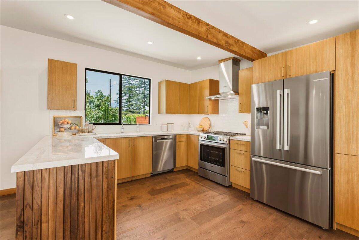 151 Kinman Avenue Goleta, CA 93117 - Photo 6 of 20 a kitchen with a sink refrigerator and window