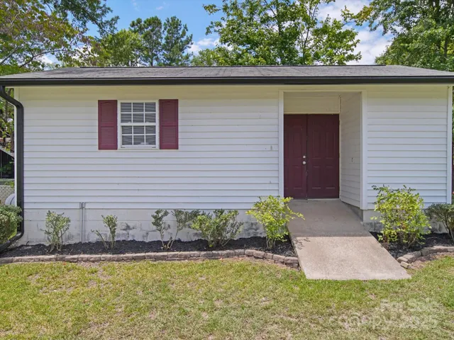 a bathroom with a sink a mirror and a shower curtain
