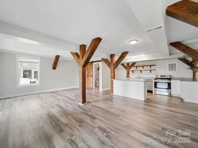 a kitchen with granite countertop a sink and stove