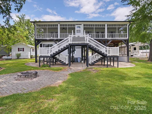 a view of a house with a yard porch and sitting area