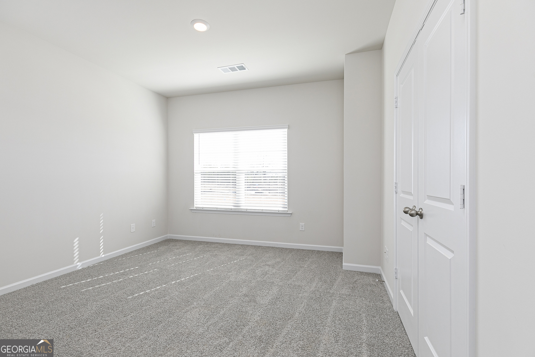 253 Rooker Drive LaGrange, GA 30241 - Photo 11 of 17 an empty room with a window