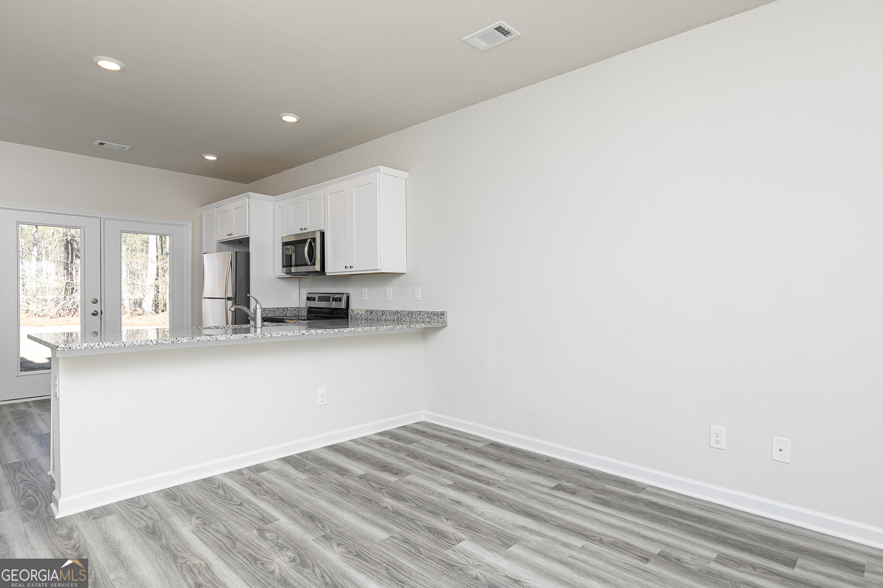 253 Rooker Drive LaGrange, GA 30241 - Photo 6 of 17 a view of kitchen with granite countertop cabinets and sink