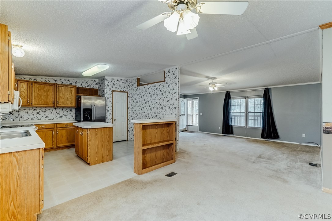 459 Bohannon Road Bumpass, VA 23024 - Photo 6 of 20 a kitchen with a refrigerator and a sink