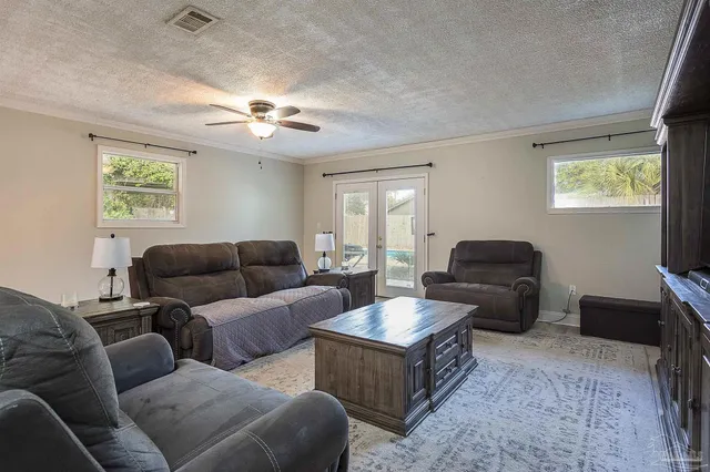 a living room with furniture and a window