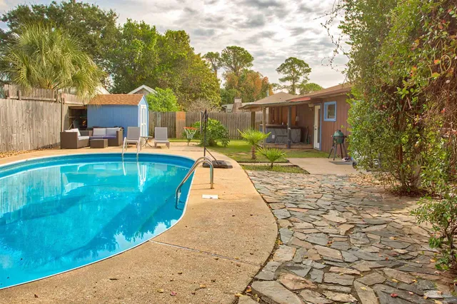 a view of a house with a swimming pool