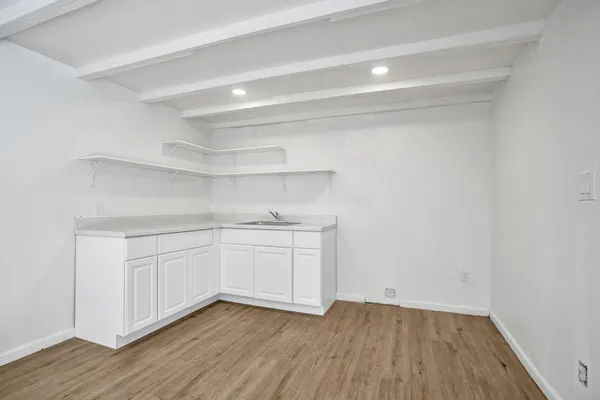 a view of cabinets and wooden floor