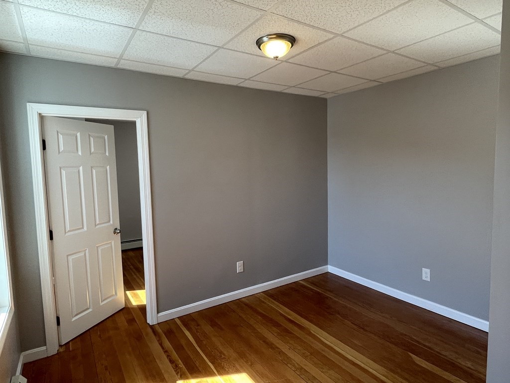 857 2nd Street Fall River, MA 02721 - Photo 13 of 38 a view of a room with wooden floor