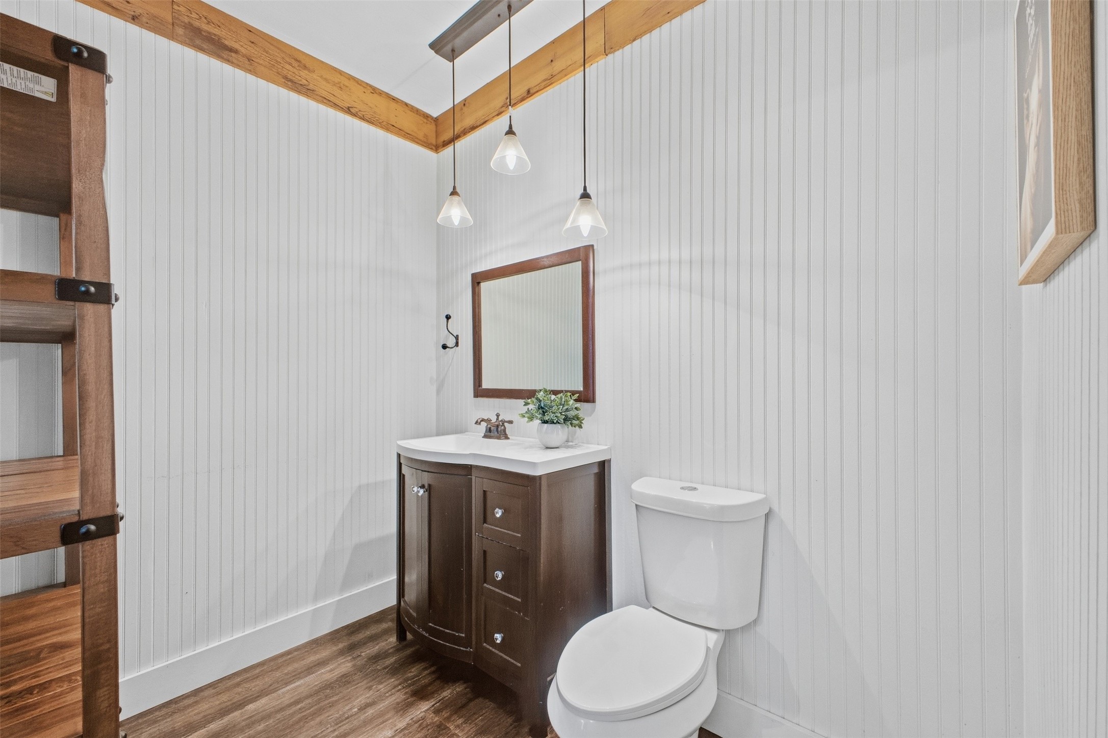 1903 Tigerpoint Road Brenham, TX 77833 - Photo 17 of 27 a bathroom with a toilet a sink and mirror