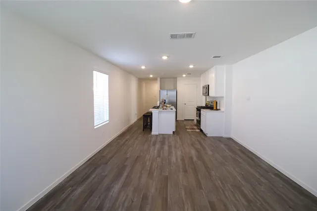 a view of kitchen with wooden floor and window