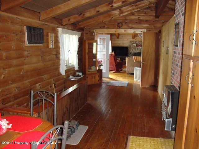 886 State Rte 4002 Laceyville, PA 18623 - Photo 15 of 44 a view of a hallway with wooden floor and staircase