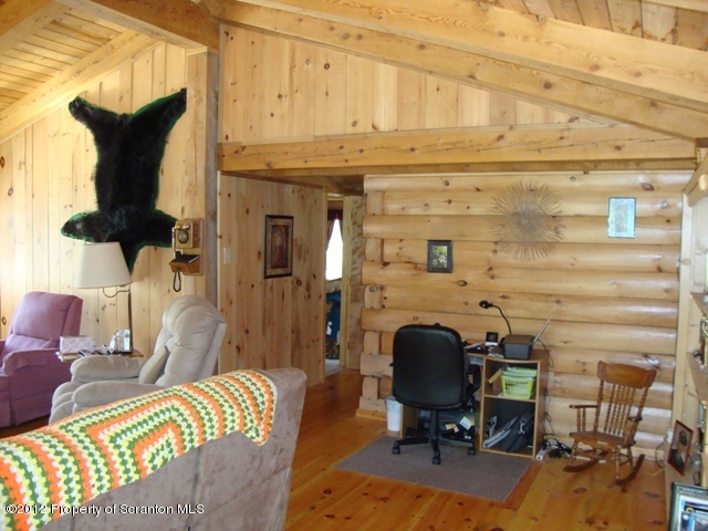 886 State Rte 4002 Laceyville, PA 18623 - Photo 19 of 44 a view of a workspace with furniture and a couch