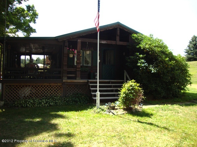 886 State Rte 4002 Laceyville, PA 18623 - Photo 2 of 44 a backyard of a house