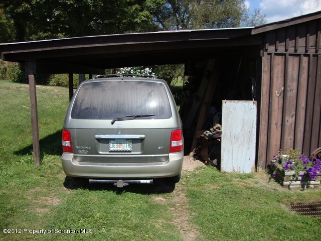 886 State Rte 4002 Laceyville, PA 18623 - Photo 34 of 44 a car parked in the grass