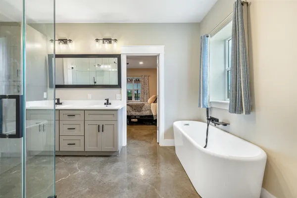 a view of a lake with houses in the back