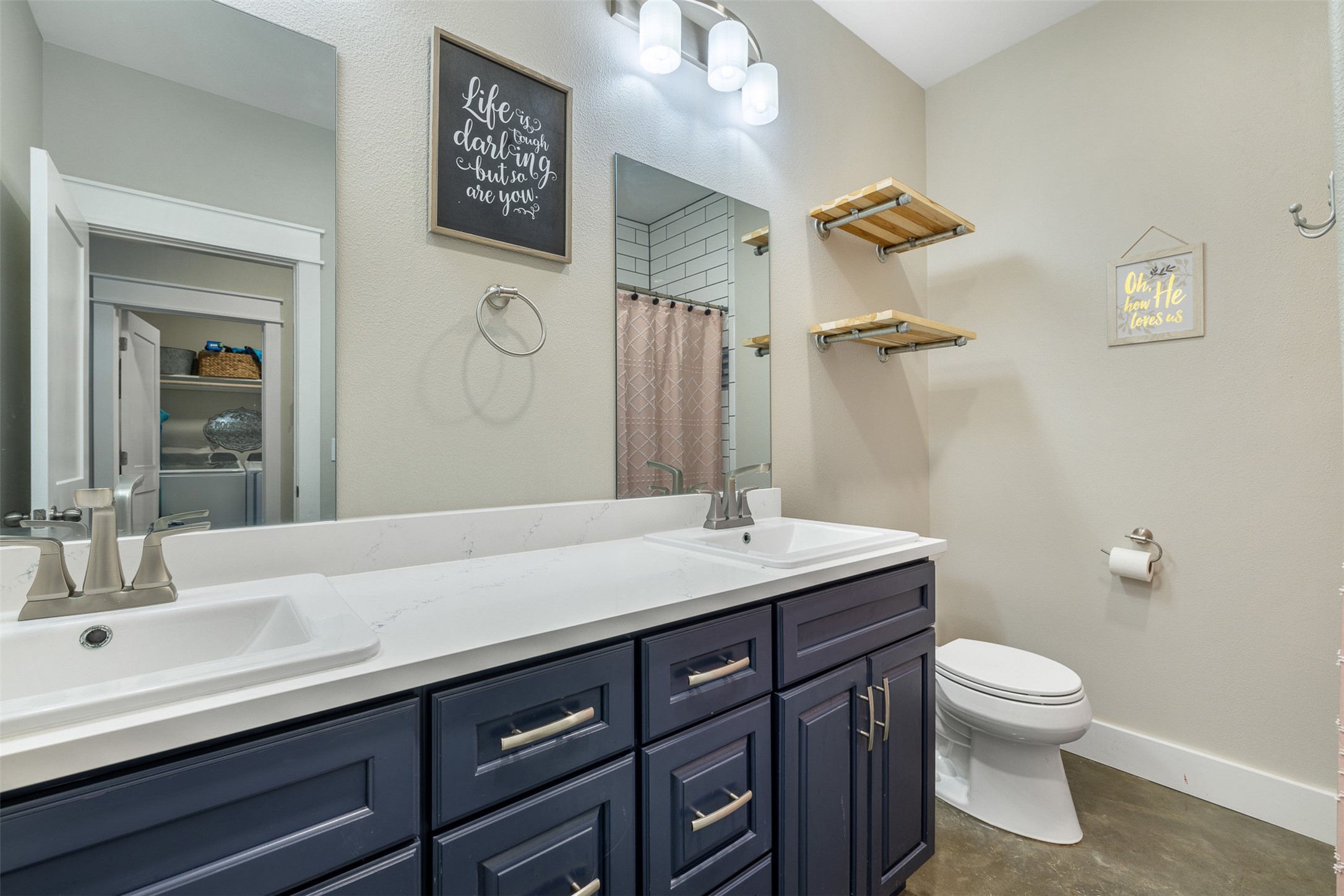 4330 Post Oak Point Road New Ulm, TX 78950 - Photo 14 of 43 a bathroom with a granite countertop sink a toilet and a mirror