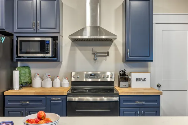 a living room with fireplace furniture and a wooden floor