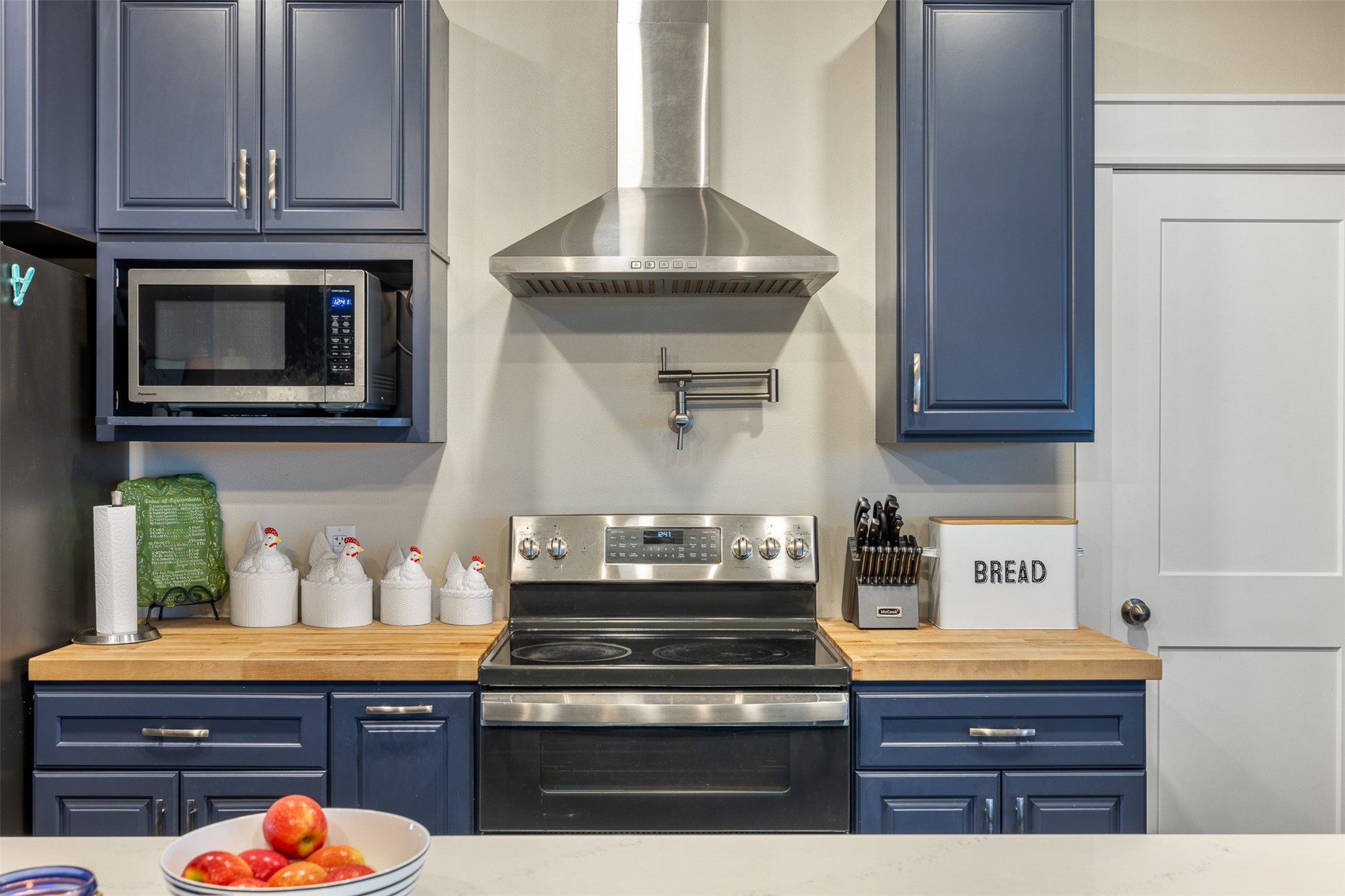 4330 Post Oak Point Road New Ulm, TX 78950 - Photo 5 of 43 a kitchen with stainless steel appliances granite countertop a stove and a microwave