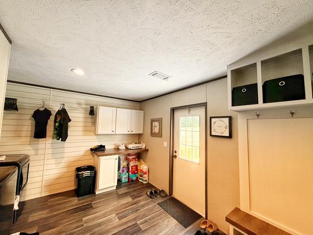 36469 1330th Road Wewoka, OK 74884 - Photo 35 of 39 Wood-finish flooring, white cabinetry, a built-in bench, and overhead storage cubbies