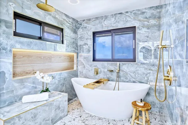 a bath tub sitting next to a bathroom