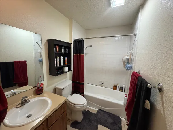 a view of a house with a chair and wooden fence