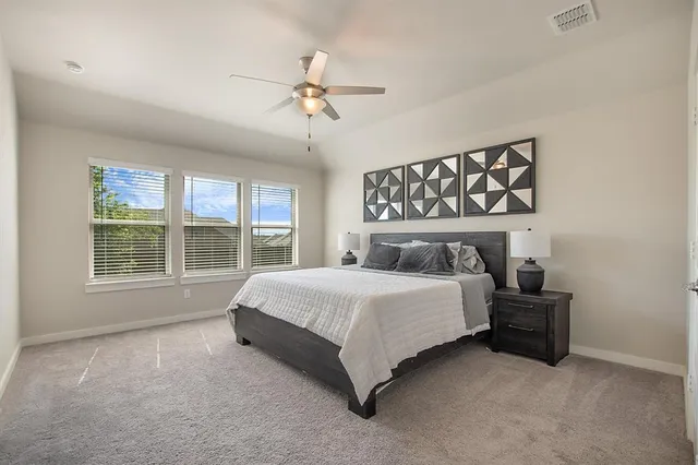 a bedroom with a bed and window