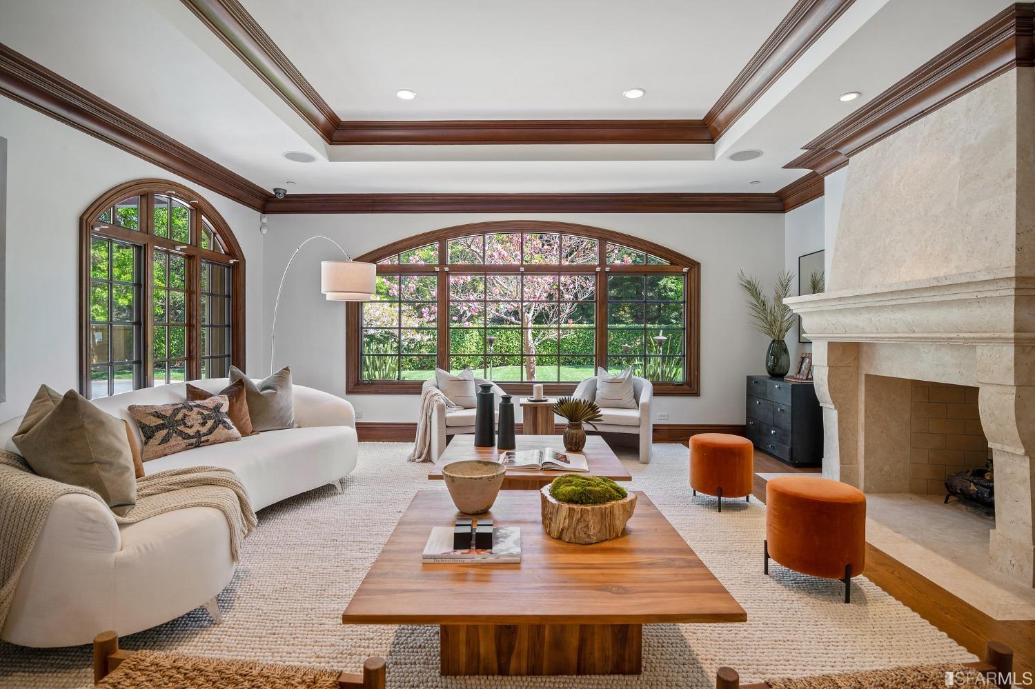 73 Irving Avenue Atherton, CA 94027 - Photo 20 of 99 a living room with furniture a fireplace and a large window