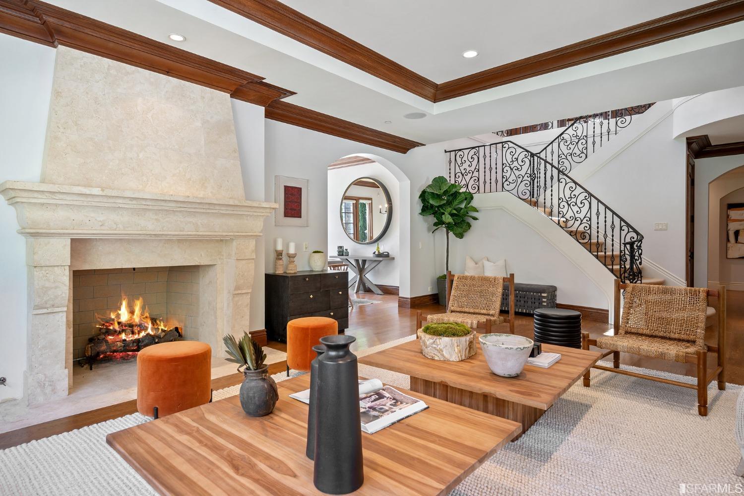 73 Irving Avenue Atherton, CA 94027 - Photo 22 of 99 a living room with furniture a fireplace and a chandelier