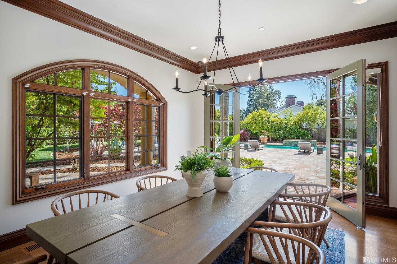 73 Irving Avenue Atherton, CA 94027 - Photo 24 of 99 a view of a dining room with furniture a chandelier and wooden floor