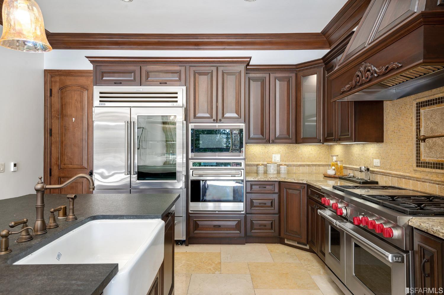 73 Irving Avenue Atherton, CA 94027 - Photo 29 of 99 a kitchen with a stove a sink and a refrigerator