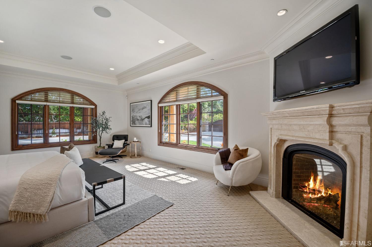 73 Irving Avenue Atherton, CA 94027 - Photo 46 of 99 a living room with a fireplace and a flat screen tv