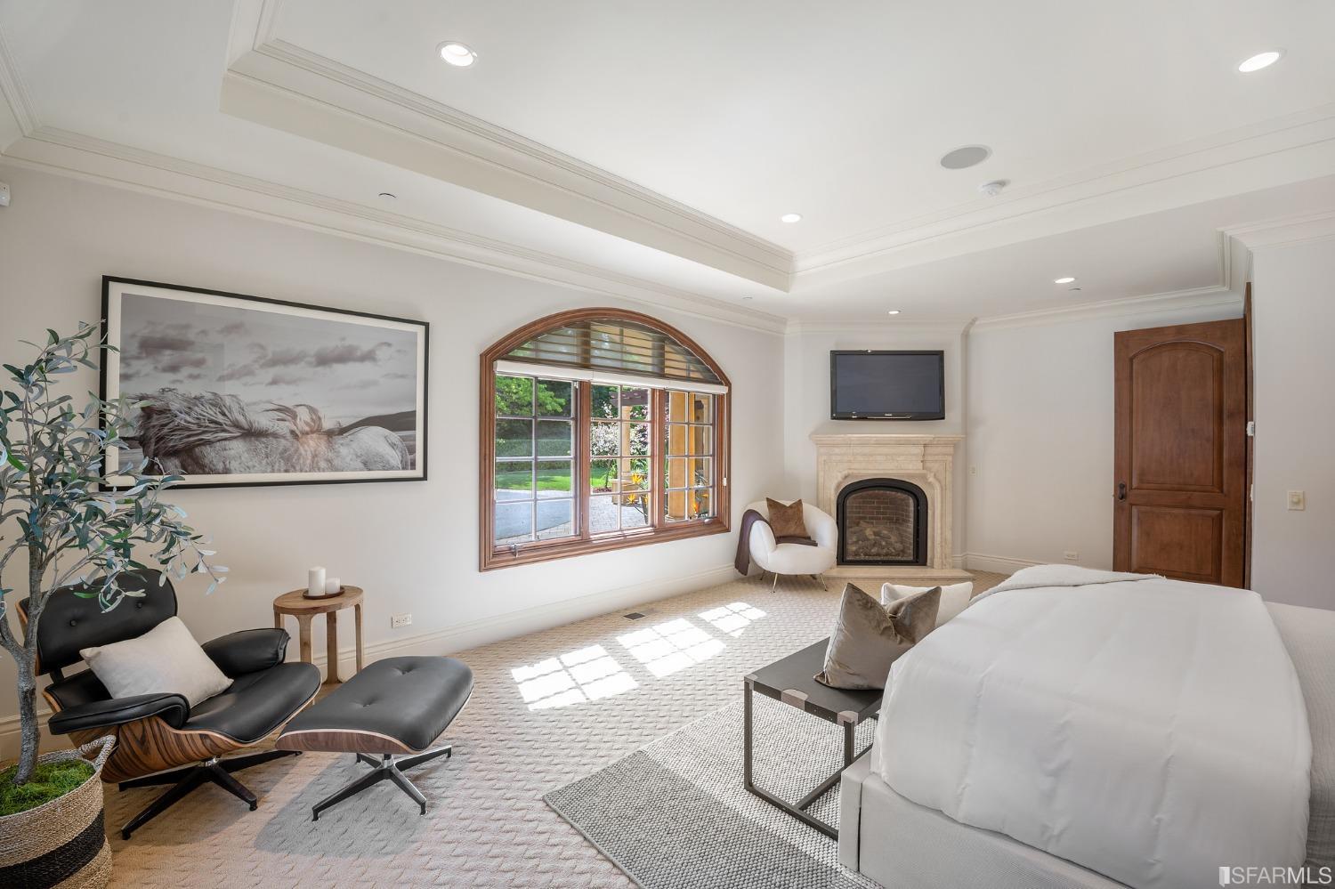 73 Irving Avenue Atherton, CA 94027 - Photo 49 of 99 a living room with furniture a fireplace and a flat screen tv