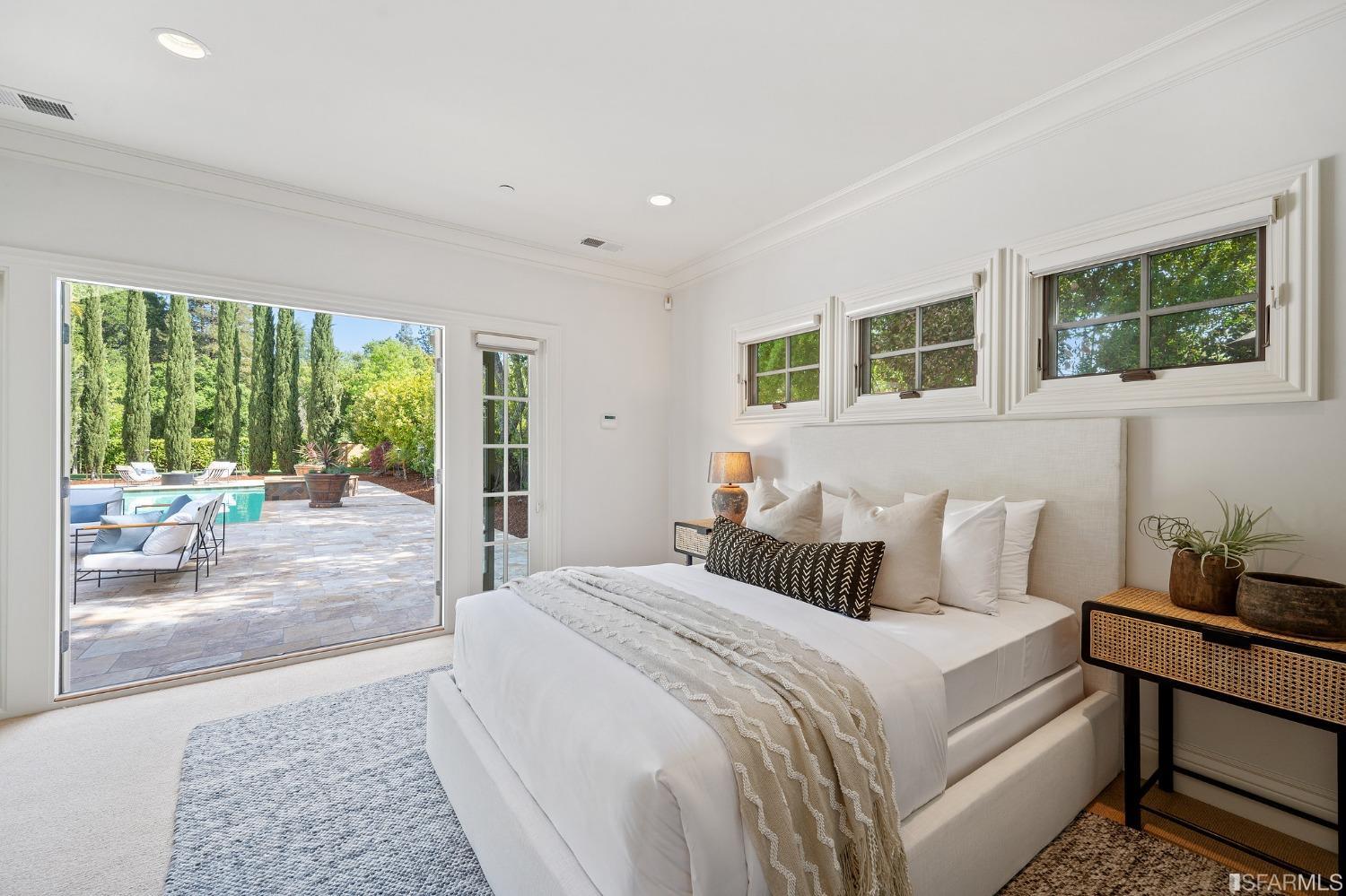 73 Irving Avenue Atherton, CA 94027 - Photo 84 of 99 a bedroom with a bed and glass window