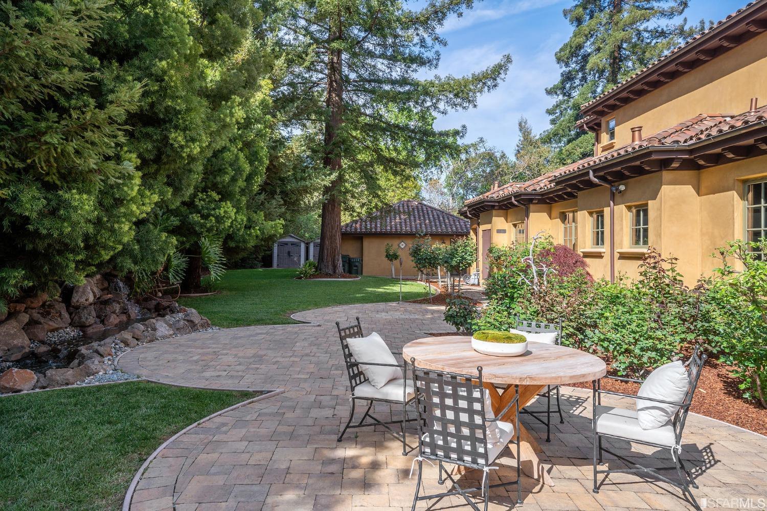 73 Irving Avenue Atherton, CA 94027 - Photo 85 of 99 a view of a patio with table and chairs and potted plants