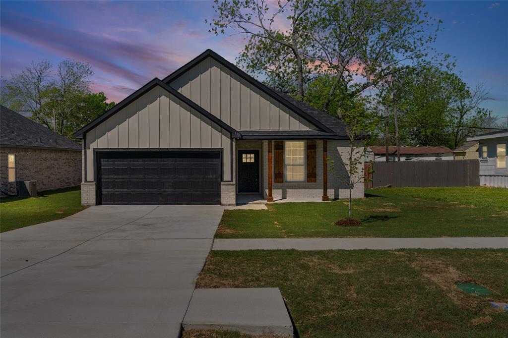 113 3rd Street Celeste, TX 75423 - Photo 39 of 39 a front view of a house with a garden and plants