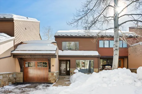 a front view of a house with parking