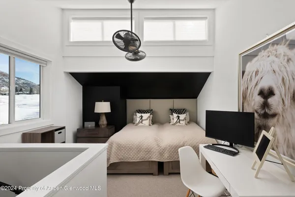 a living room with furniture and flat screen tv