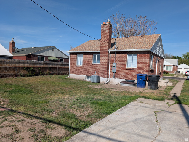 2880 Merton Way Magna, UT 84044 - Photo 26 of 30 Brick exterior with a gabled roof and light brown shingles