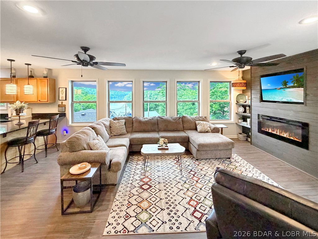 28251 Shore Road Warsaw, MO 65355 - Photo 12 of 51 Living Room with fireplace and lake view!
