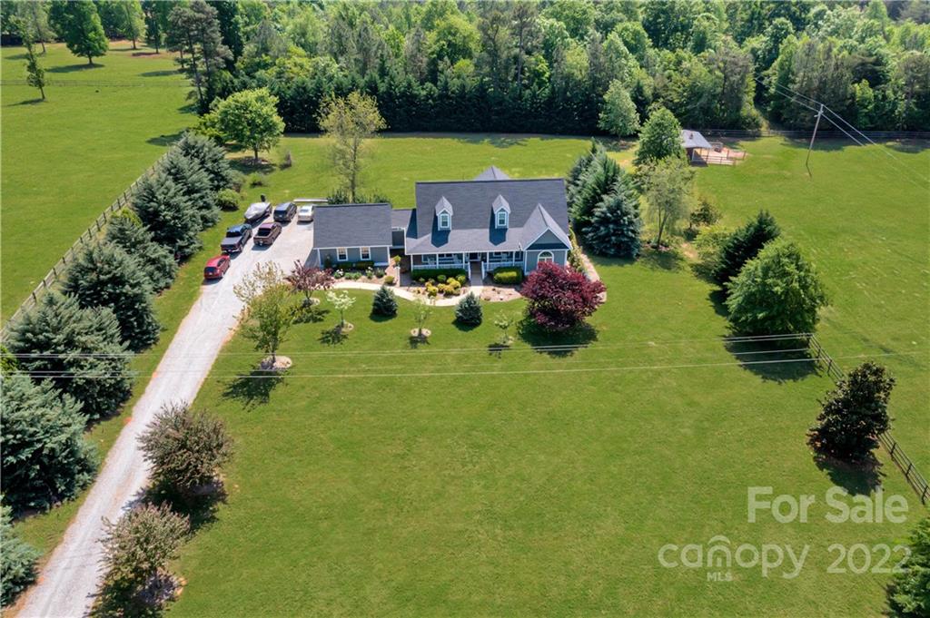991 Golf Course Road Tryon, NC 28782 - Photo 13 of 43 a aerial view of a house with a garden