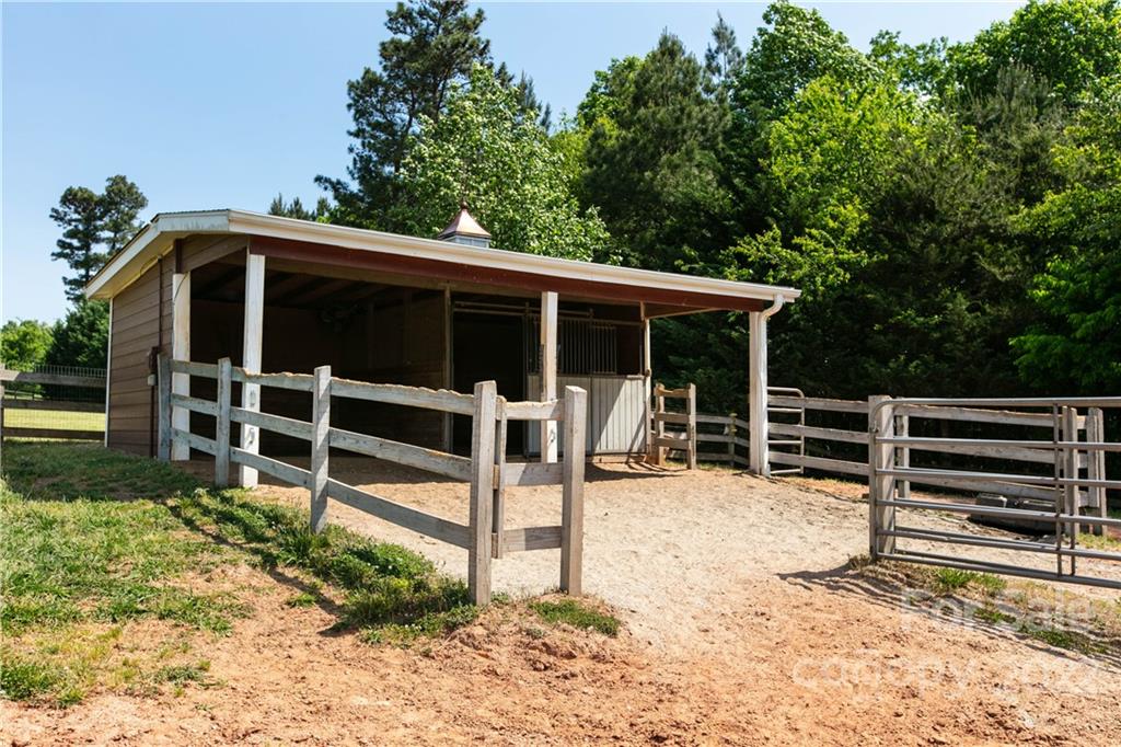 991 Golf Course Road Tryon, NC 28782 - Photo 15 of 43 a view of an chairs and table in the garden