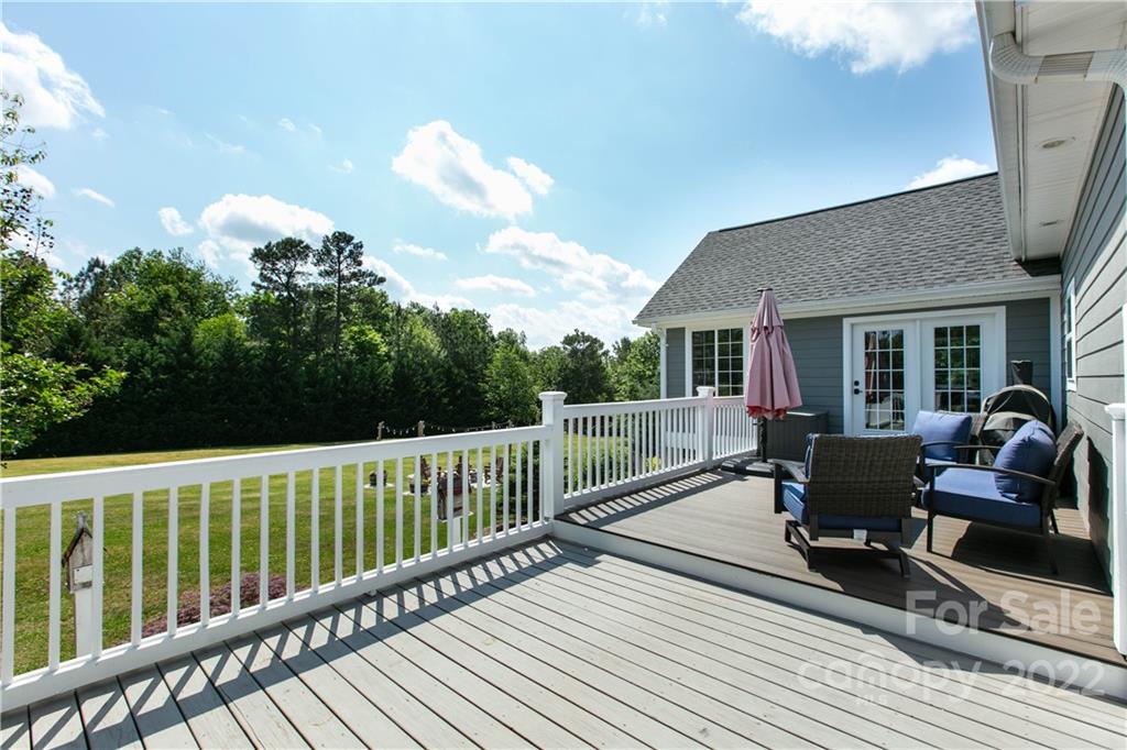991 Golf Course Road Tryon, NC 28782 - Photo 17 of 43 a view of a deck with furniture