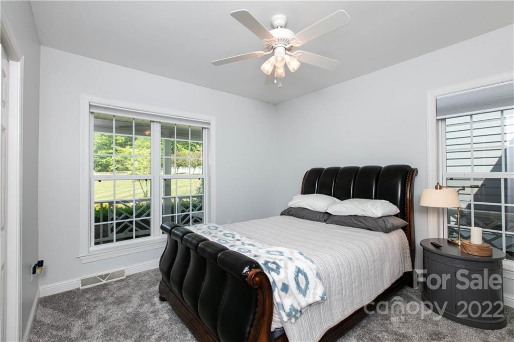 991 Golf Course Road Tryon, NC 28782 - Photo 18 of 43 a bedroom with a bed and a window
