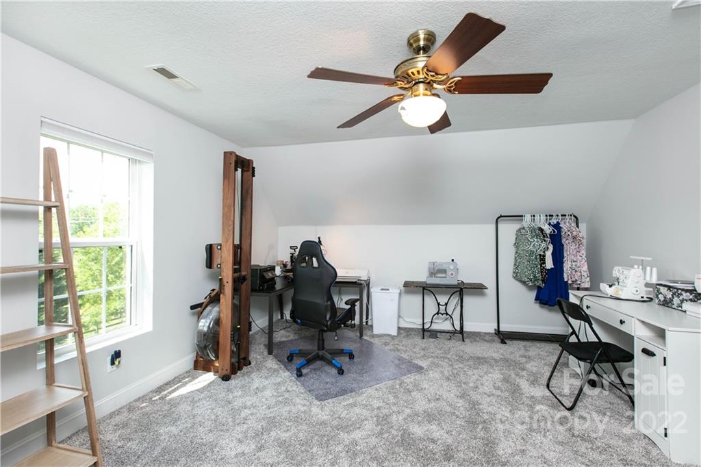 991 Golf Course Road Tryon, NC 28782 - Photo 22 of 43 a view of a workspace with furniture and a window