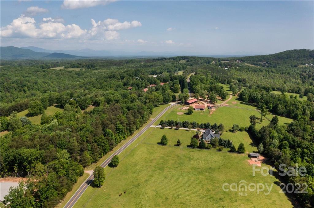 991 Golf Course Road Tryon, NC 28782 - Photo 29 of 43 an aerial view of a house with a yard
