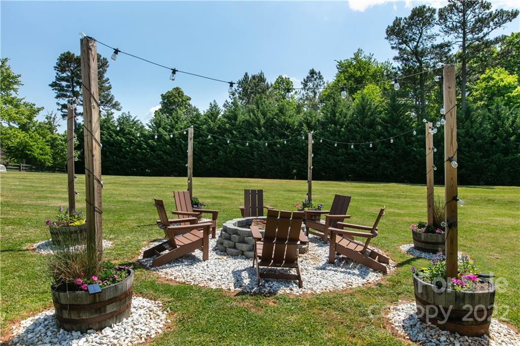 991 Golf Course Road Tryon, NC 28782 - Photo 30 of 43 a view of a chairs and table in the garden
