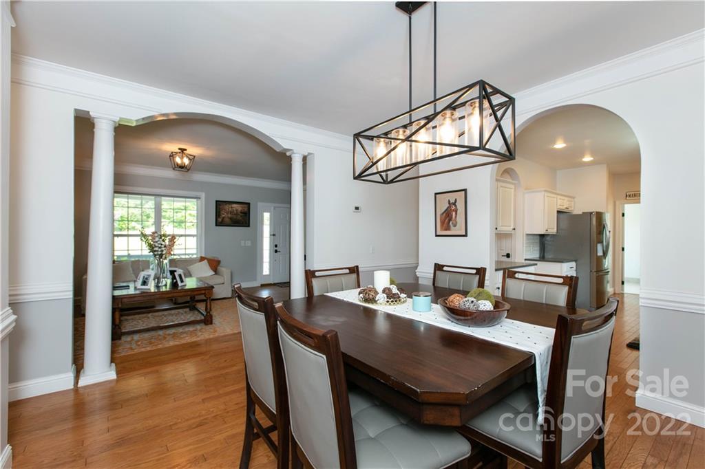 991 Golf Course Road Tryon, NC 28782 - Photo 32 of 43 a dining room with furniture and wooden floor